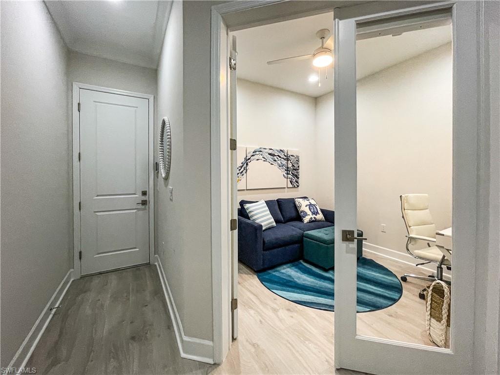 Hallway featuring hardwood / wood-style floors