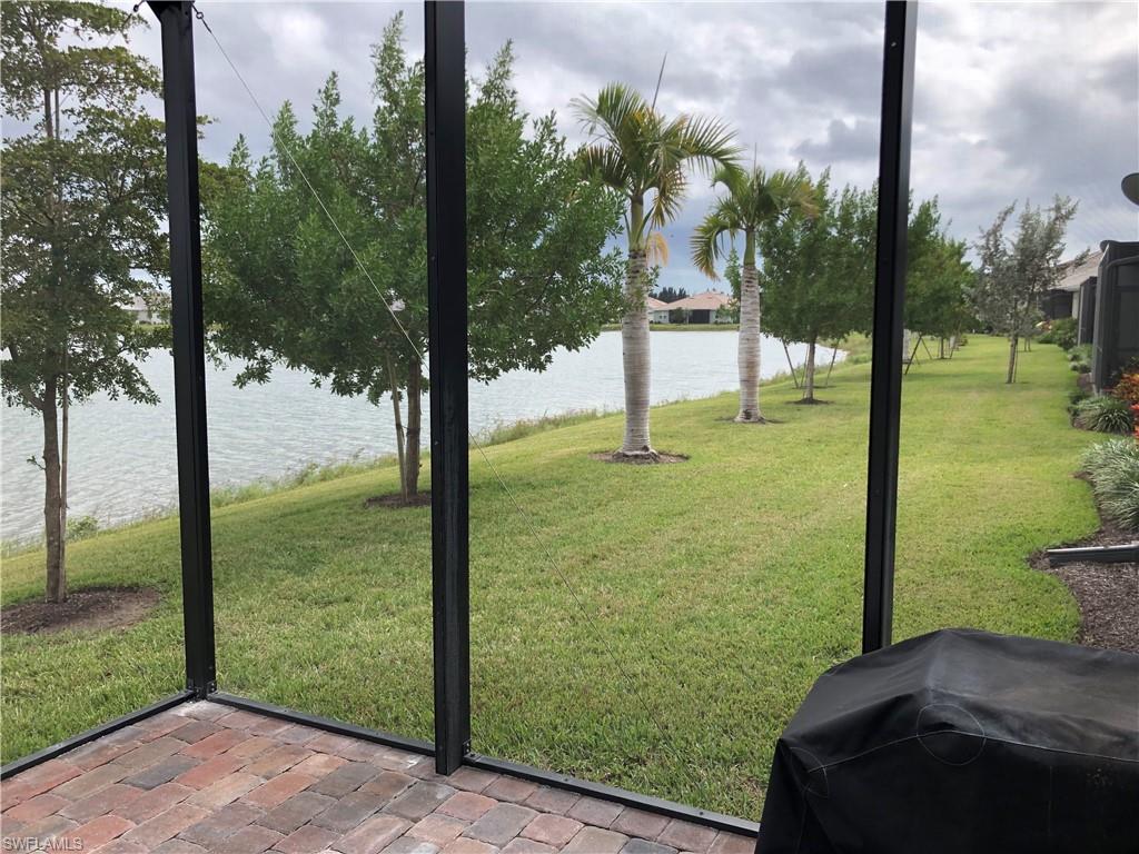 Gas grill on the oversize patio with storm screens...