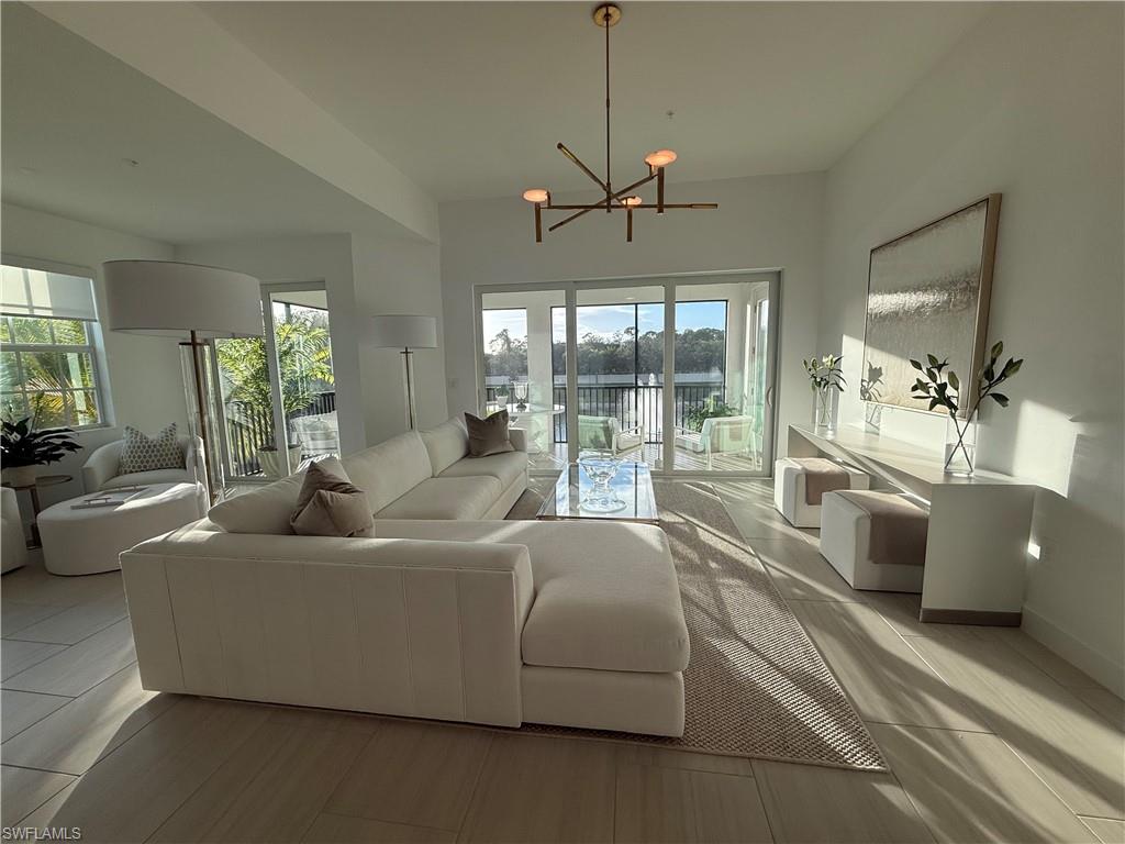 Living area with healthy amount of natural light and a chandelier