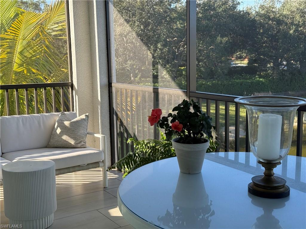 Outside screen lanai featuring plenty of natural light and a water view