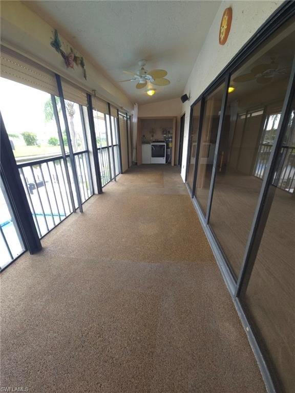 Unfurnished sunroom featuring carpet flooring