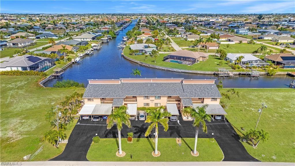 Aerial perspective of suburban area with a nearby body of water