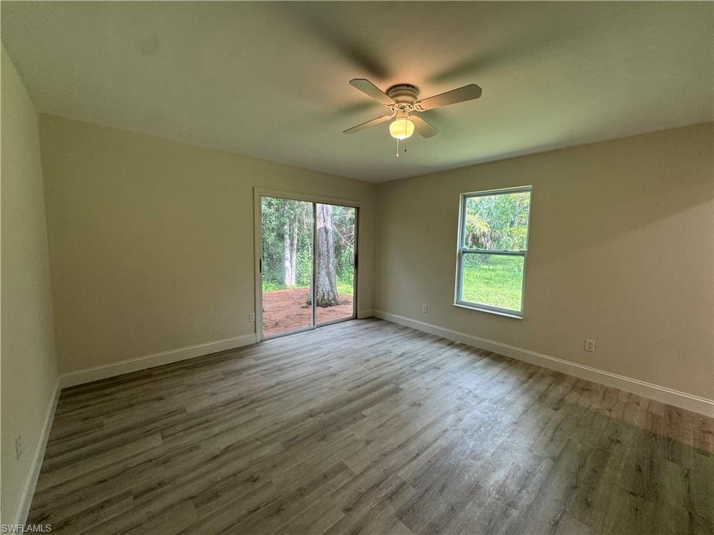 Spare room featuring light wood-style floors and ceiling fan