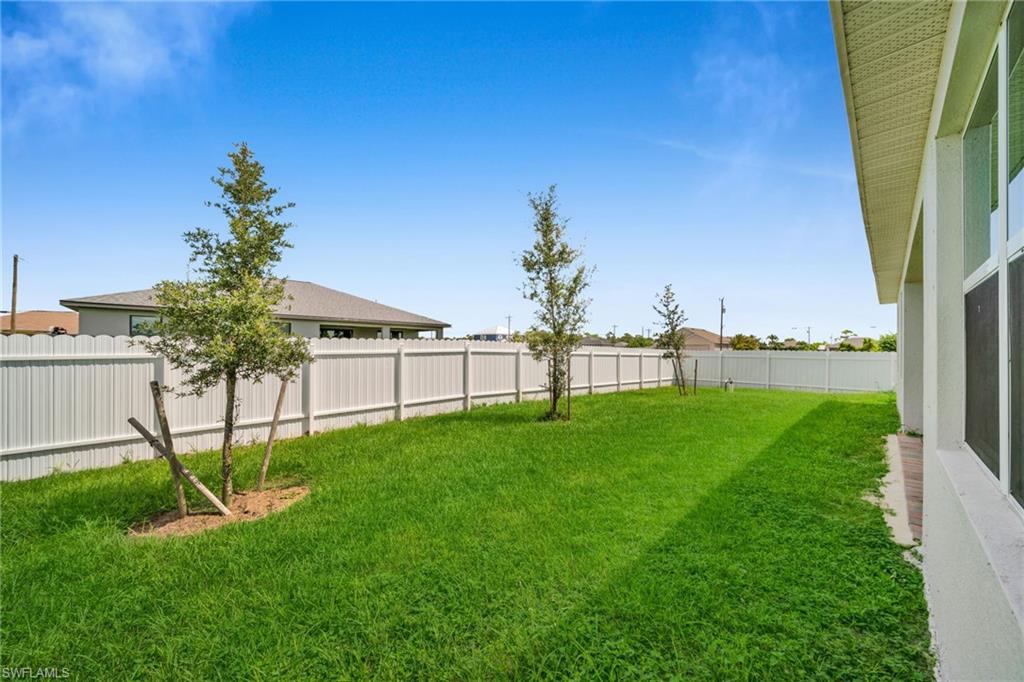 View of fenced backyard