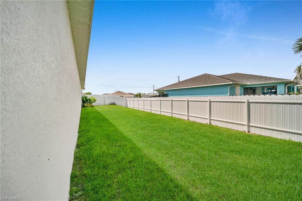 View of fenced backyard