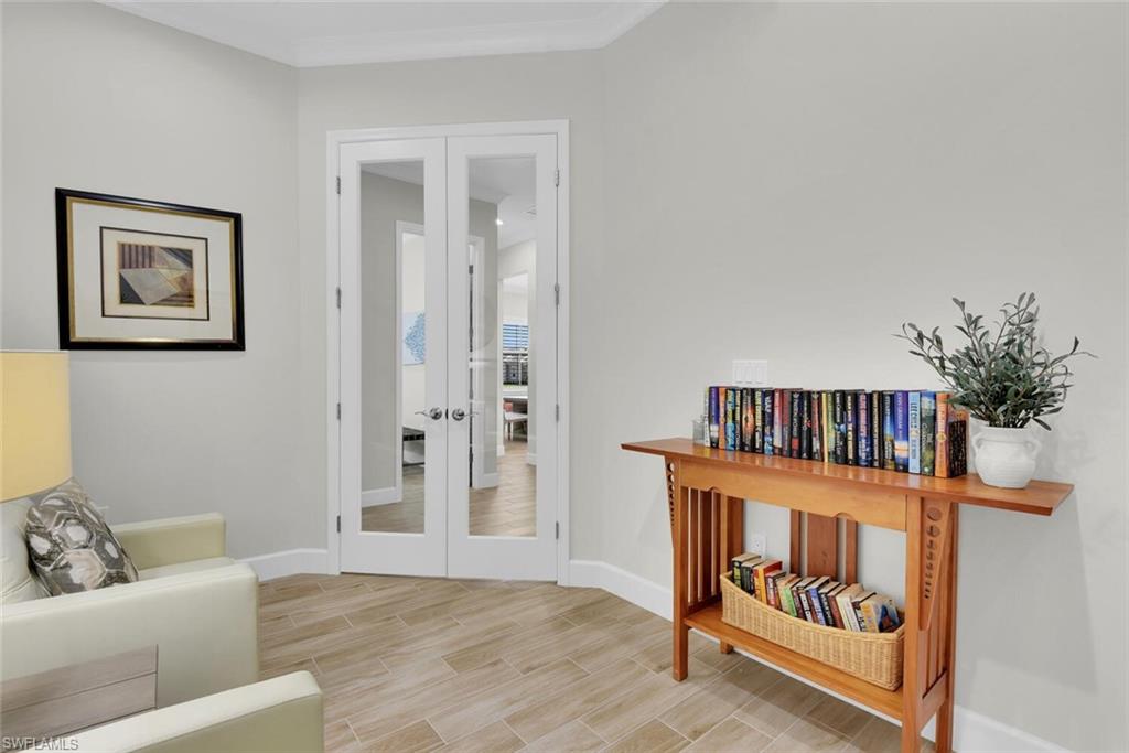 Living area featuring light hardwood / wood-style floors and french doors