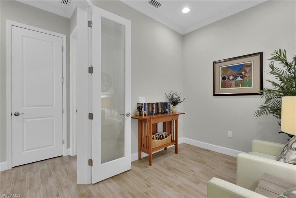 Living area with light hardwood / wood-style flooring