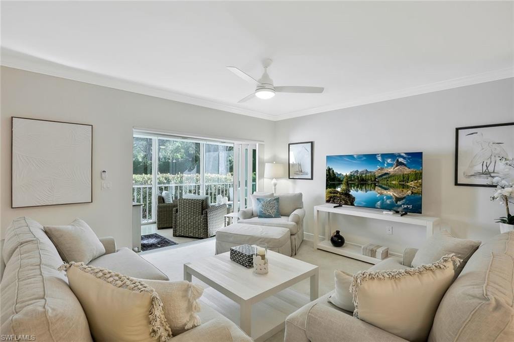 Living area with ,crown molding, and ceiling fan