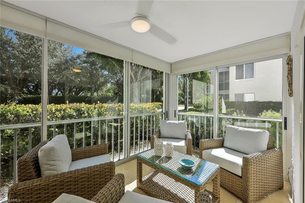 Sunroom / solarium featuring ceiling fan and an outdoor living space