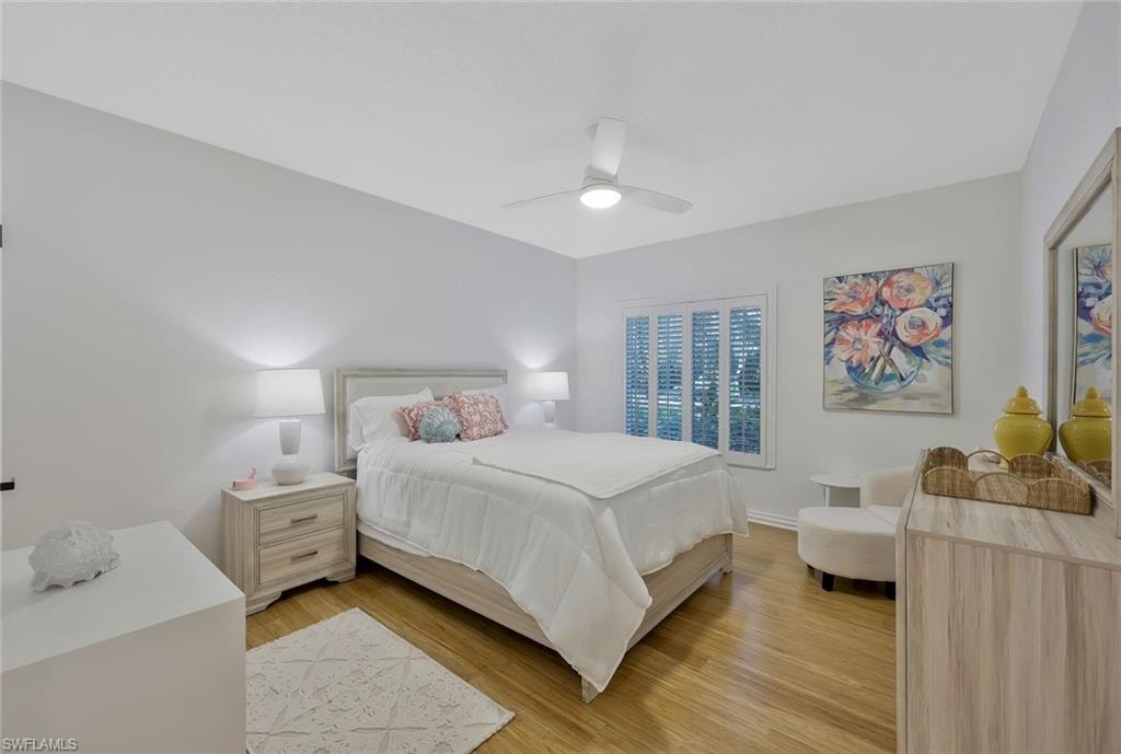 Bedroom featuring light wood finished floors and a ceiling fan
