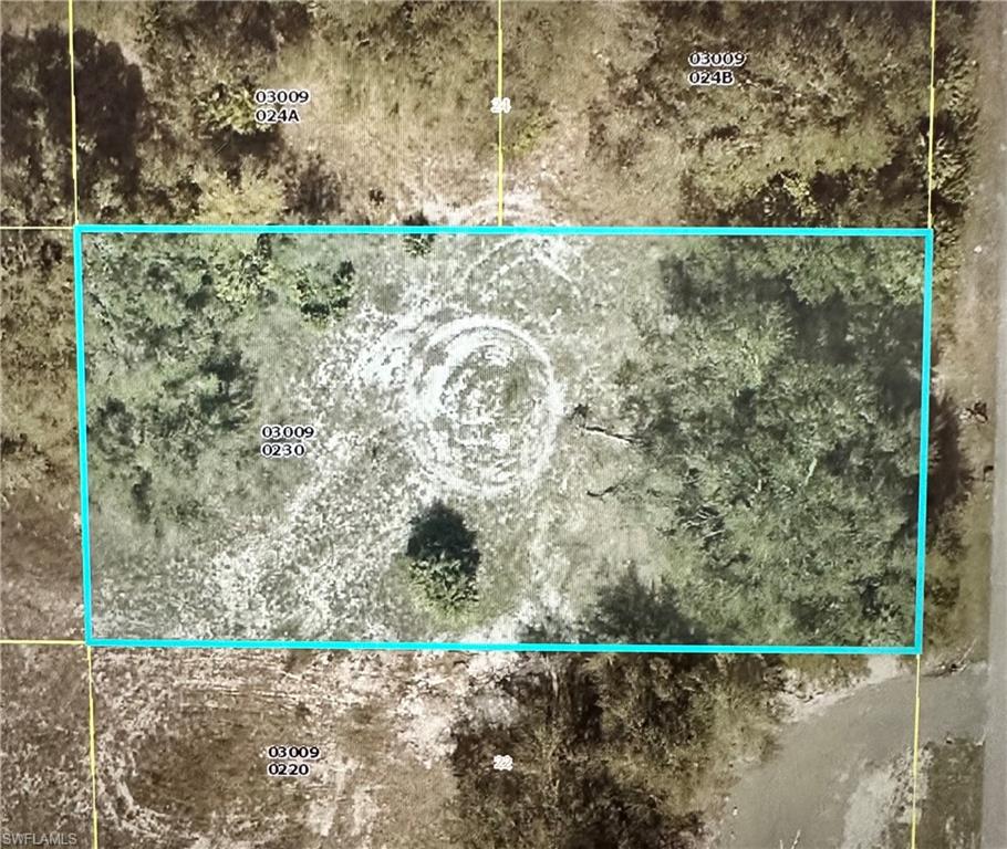 Aerial view of property's location featuring property parcel outlined
