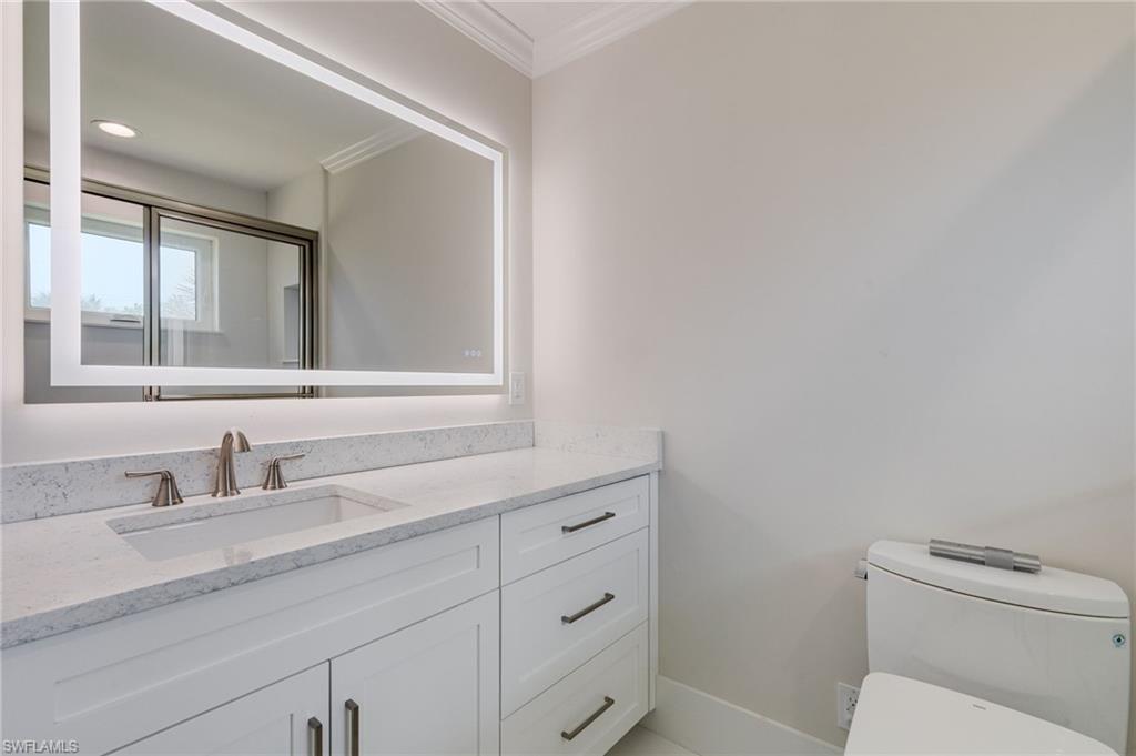 Custom Quartz Countertops in Every Wet Area, Including this Guest En-Suite