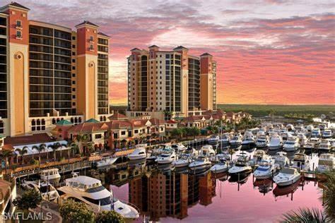 View of city with a nearby body of water and a marina