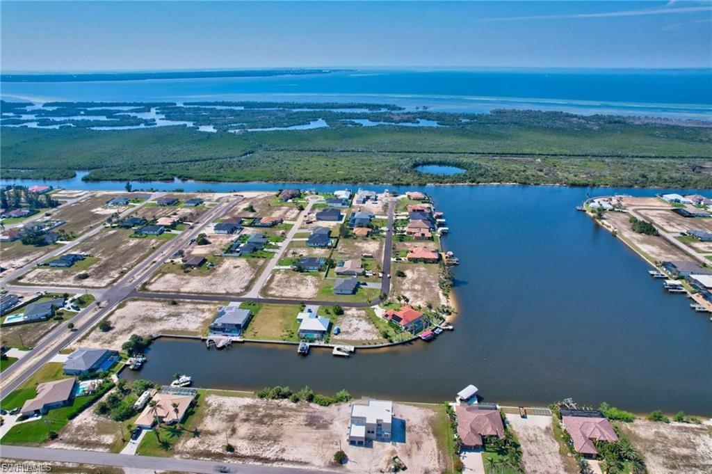 Aerial perspective of suburban area with a large body of water