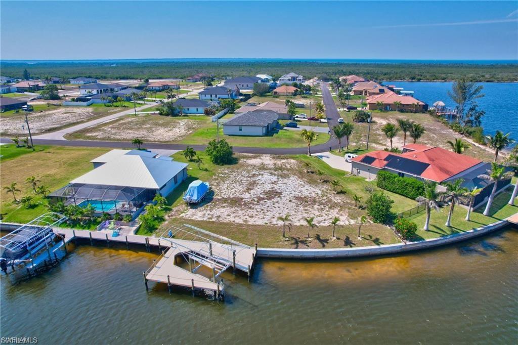 Aerial view of residential area featuring a large body of water