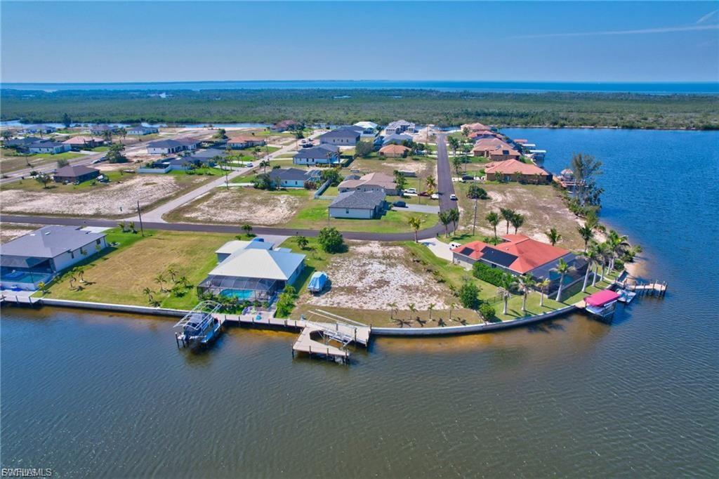 Aerial perspective of suburban area with a large body of water
