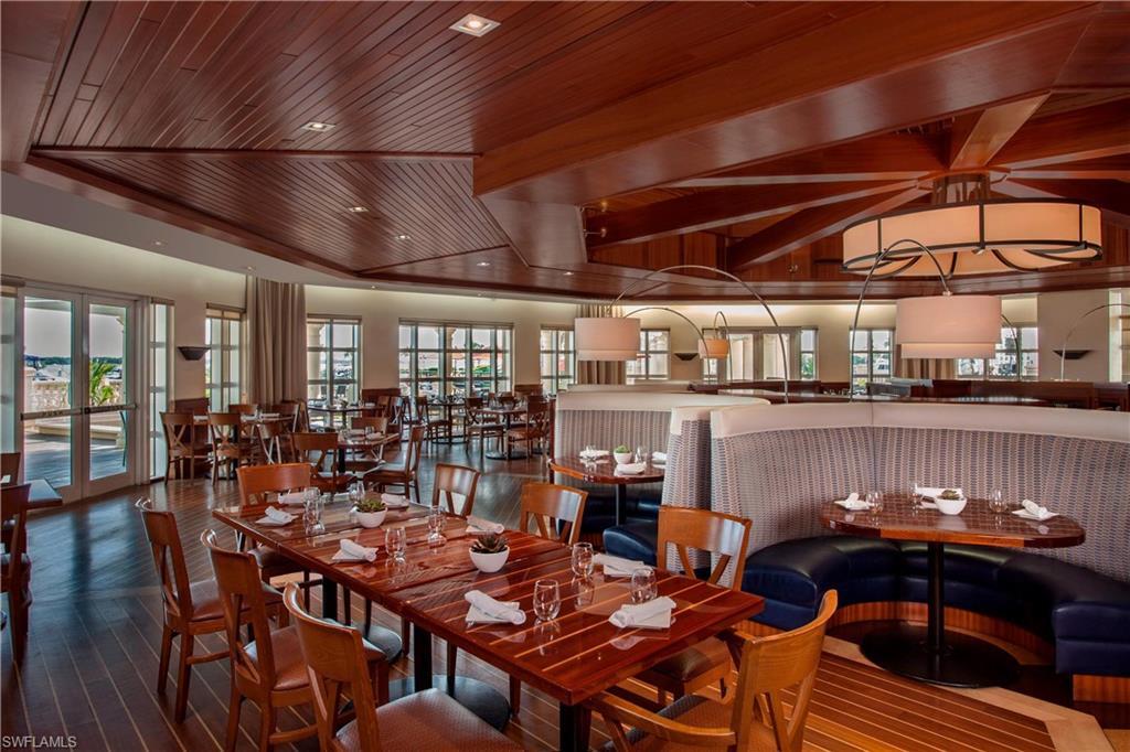 Dining room with wooden ceiling, healthy amount of natural light, recessed lighting, and dark wood finished floors