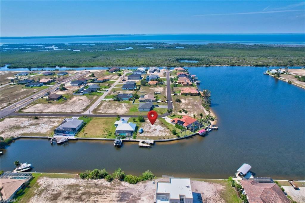 Aerial perspective of suburban area with a large body of water