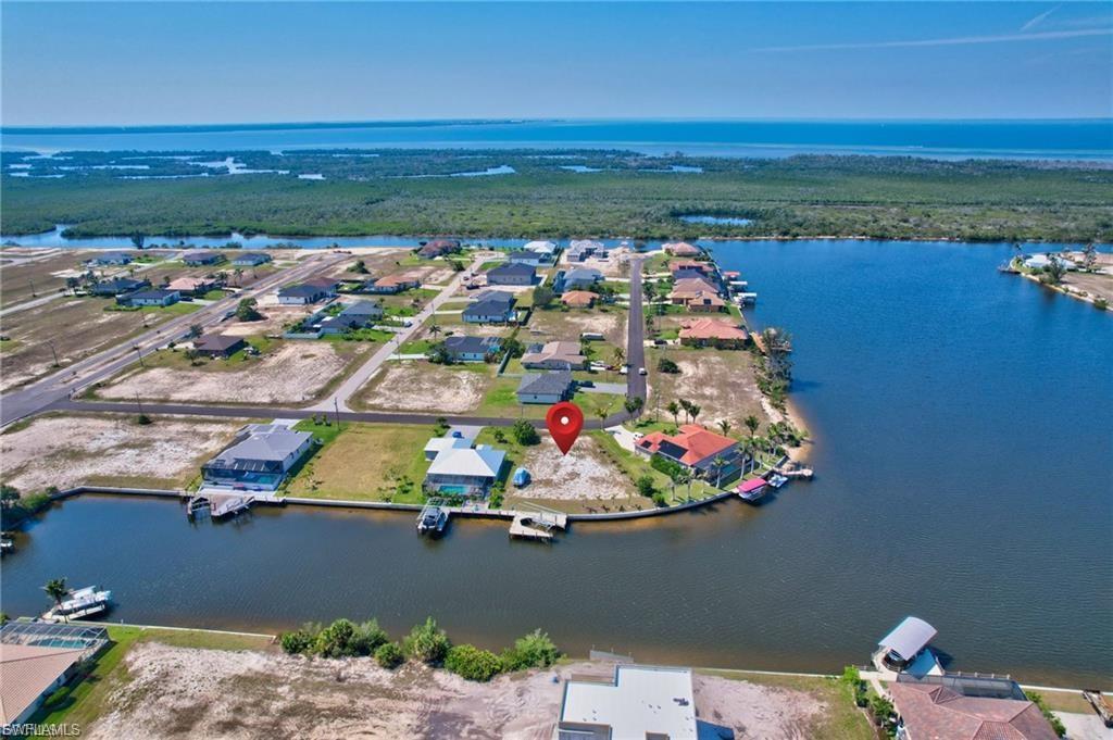 Aerial view of residential area featuring a large body of water