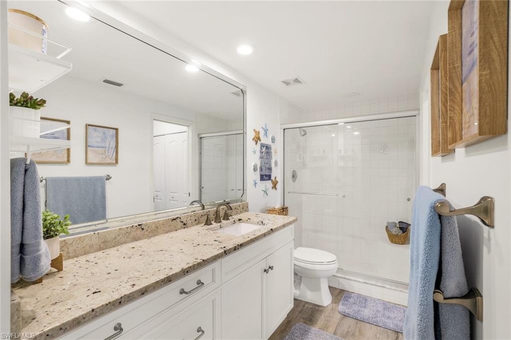 Full bath featuring vanity and a shower