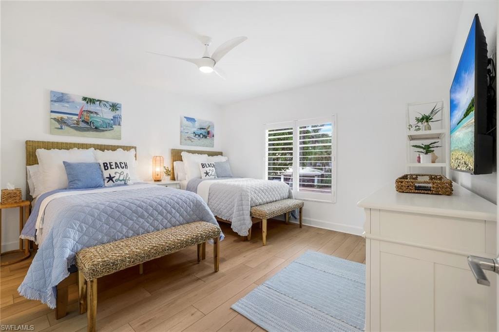 Bedroom with two full size beds and a TV