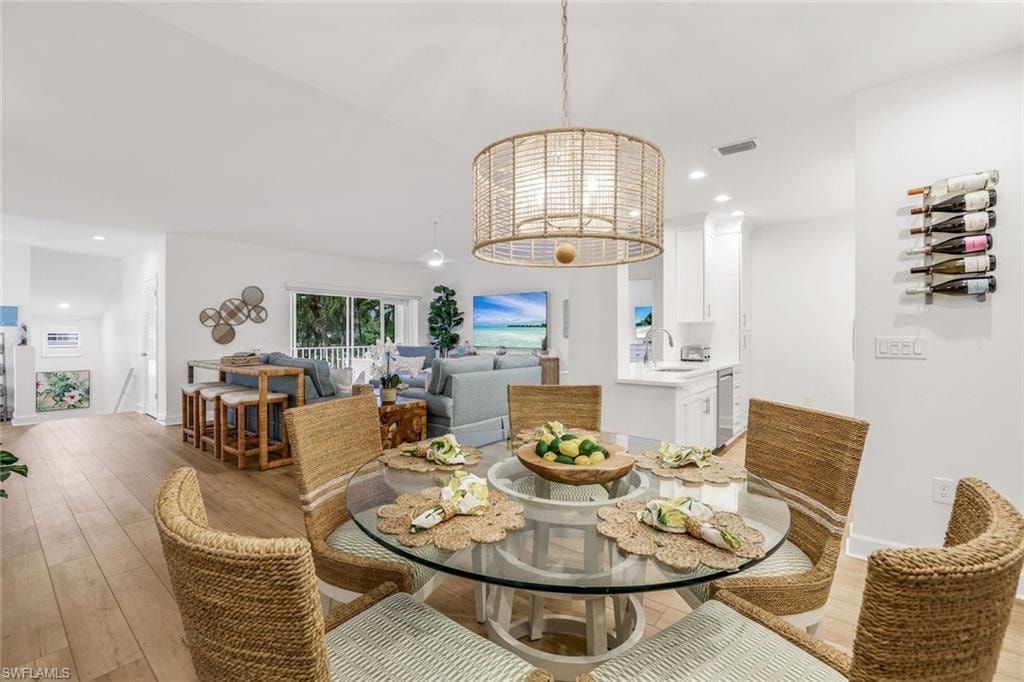 Dining area with recessed lighting and a chandelier