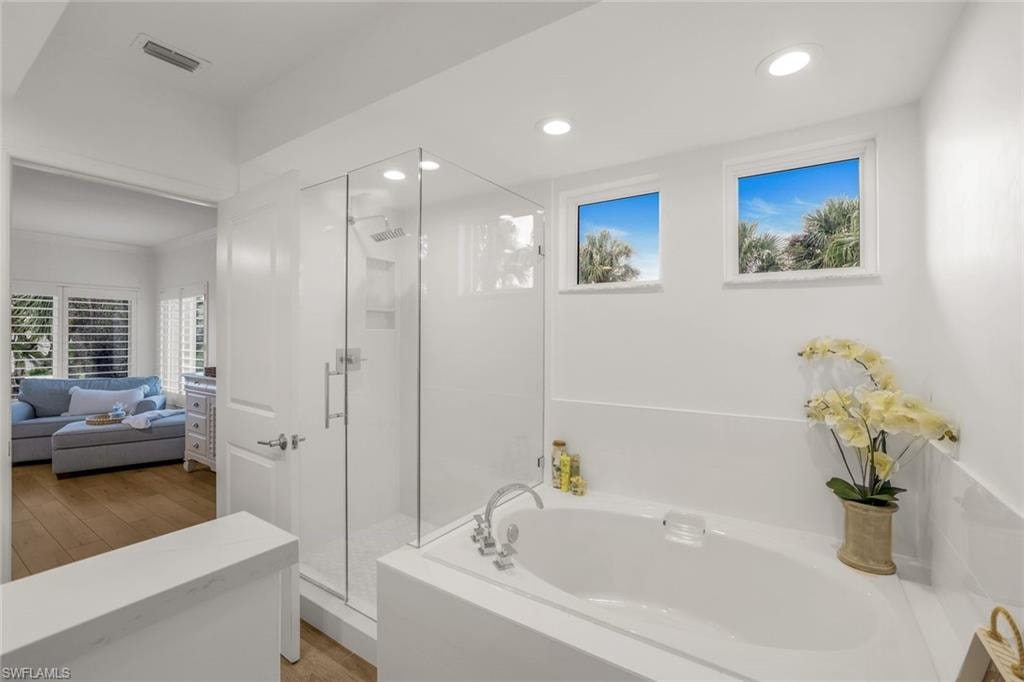 Ensuite bathroom with separate tub and shower