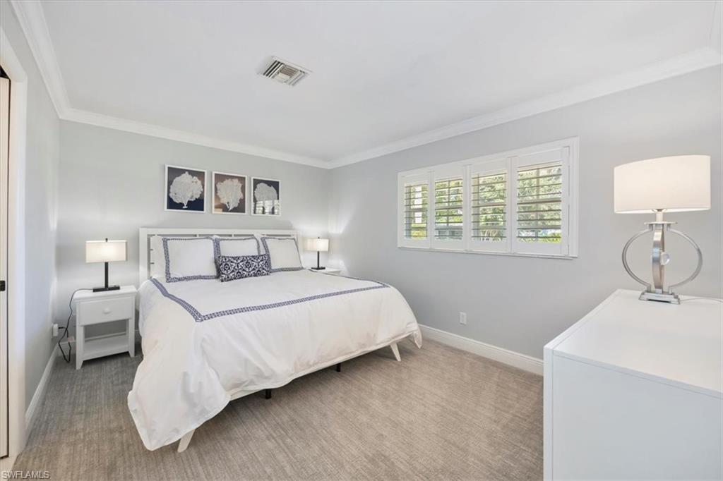Primary Bedroom features a plush King sized bed.