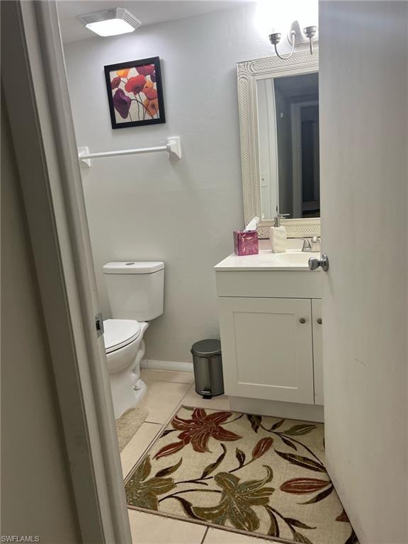 Bathroom with vanity and tile patterned floors