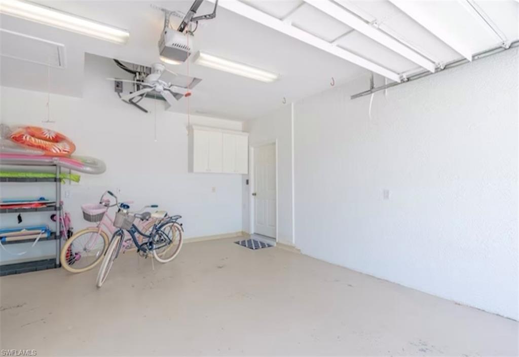 Garage featuring a garage door opener