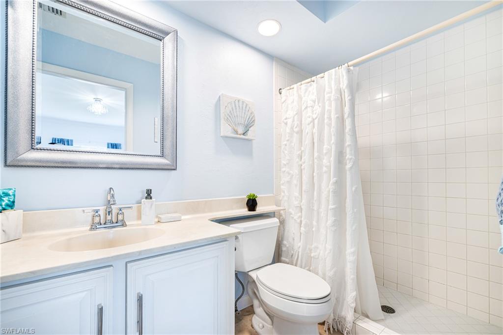Bathroom with vanity and a shower stall