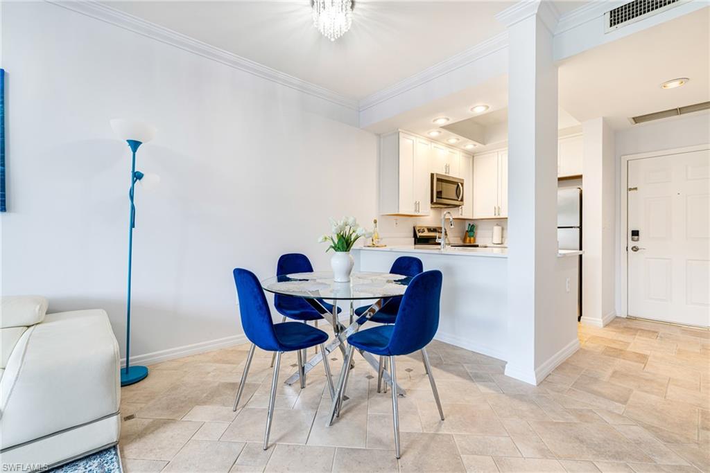 Dining room featuring crown molding and recessed lighting