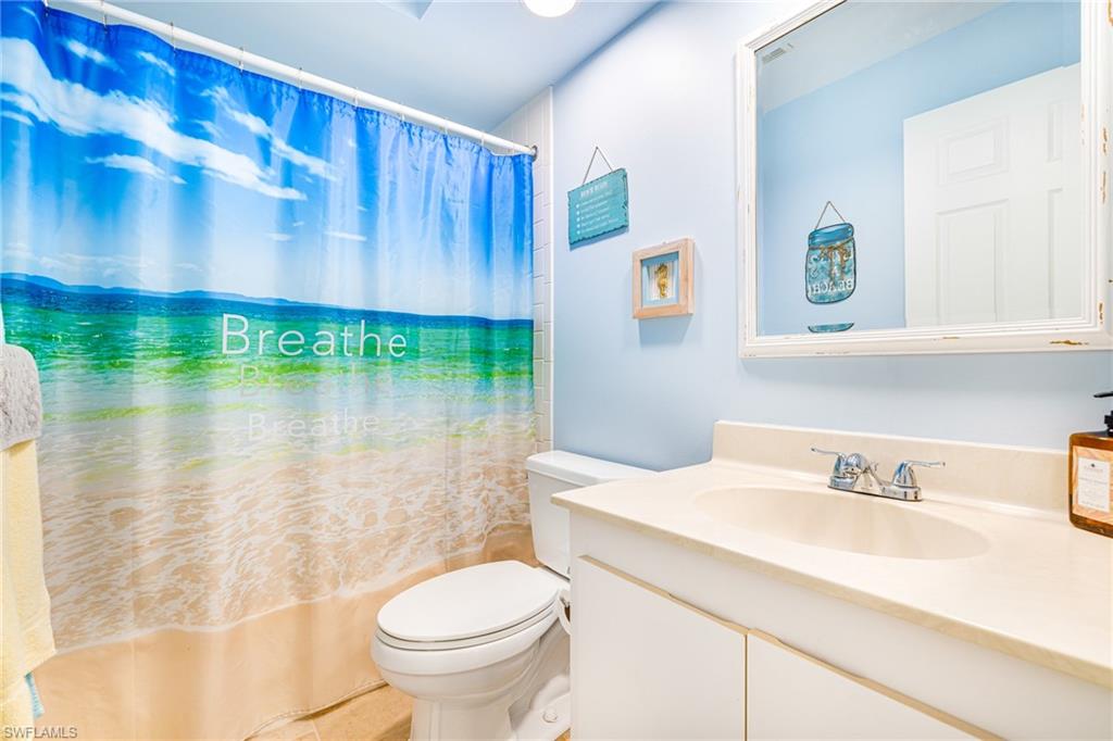 Bathroom with vanity and shower / bath combo