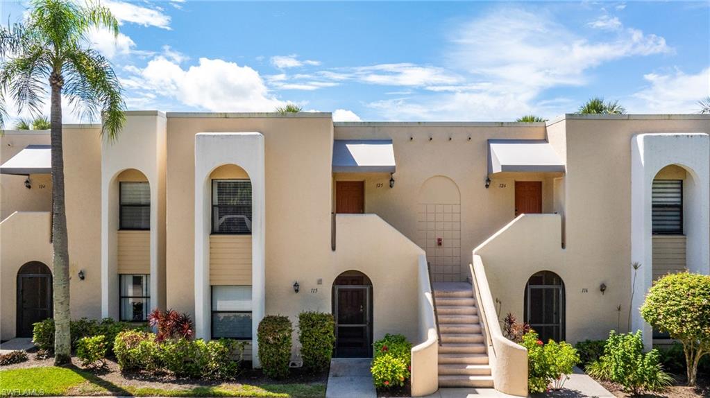 Mediterranean / spanish-style house featuring stucco siding and stairs