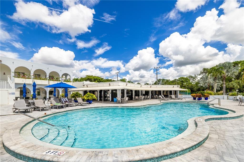 Community pool with a patio area