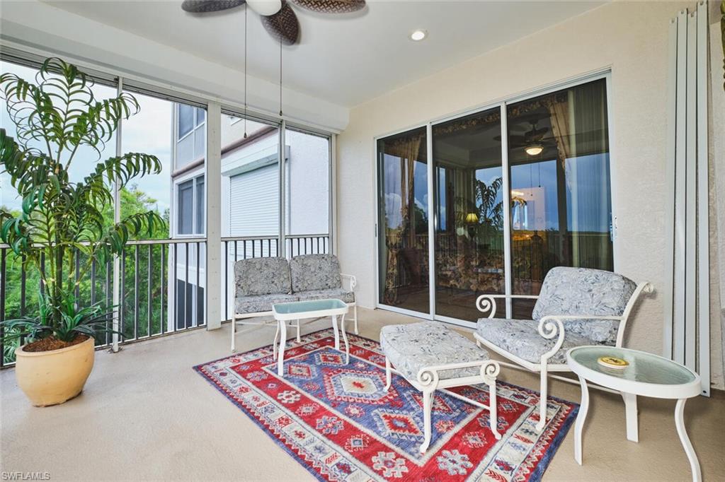 Sunroom featuring carpet flooring and recessed lighting