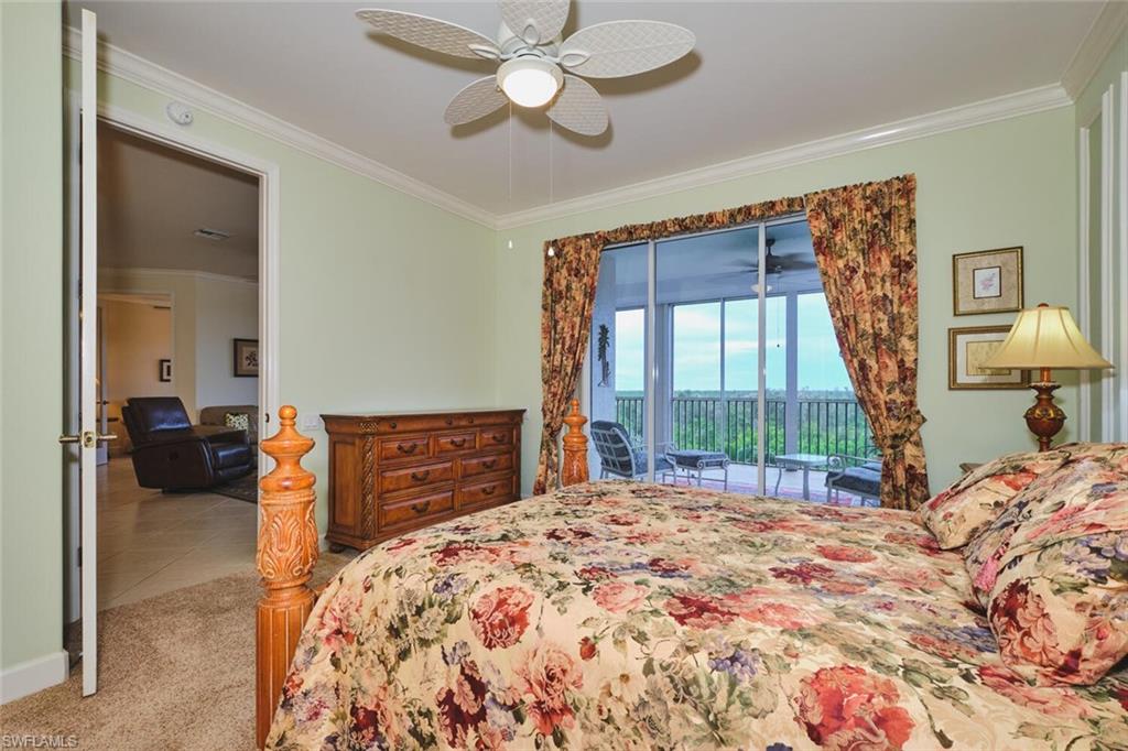 Bedroom with crown molding, light carpet, access to outside, ceiling fan, and light tile patterned flooring