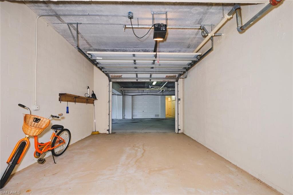 Garage featuring a garage door opener