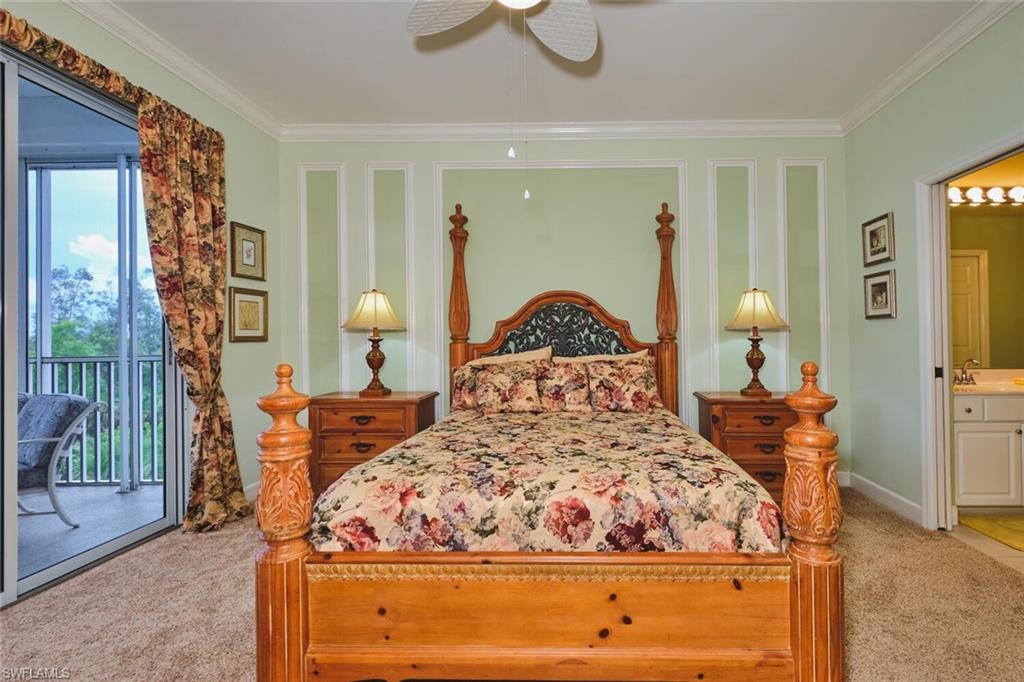 Bedroom featuring crown molding, access to exterior, light colored carpet, connected bathroom, and ceiling fan