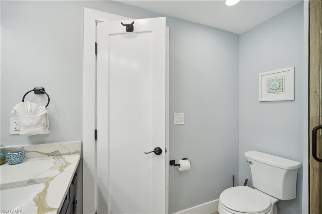 Bathroom with vanity and recessed lighting