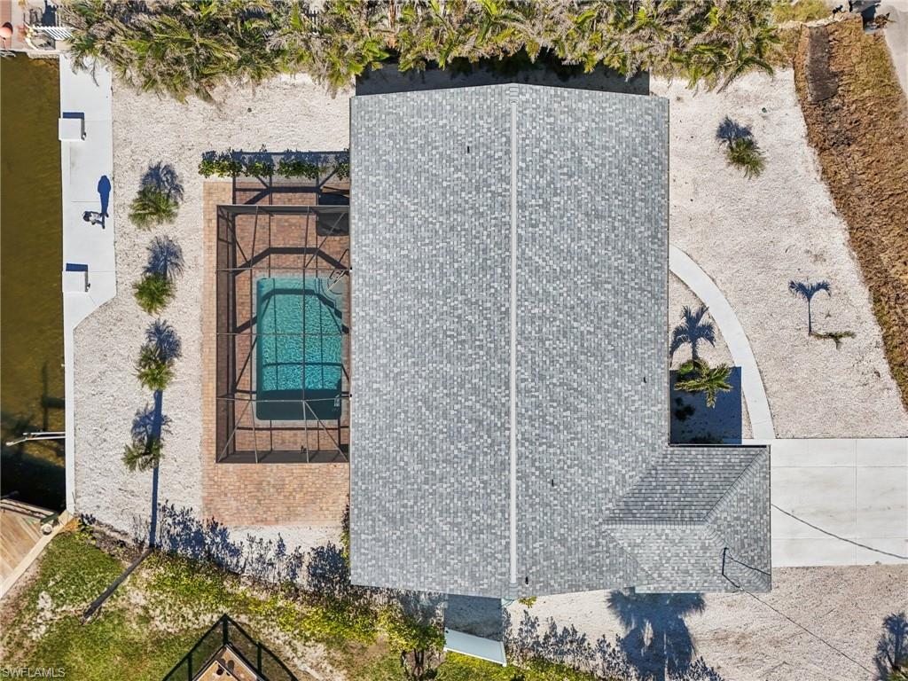 View of subject property featuring a pool area