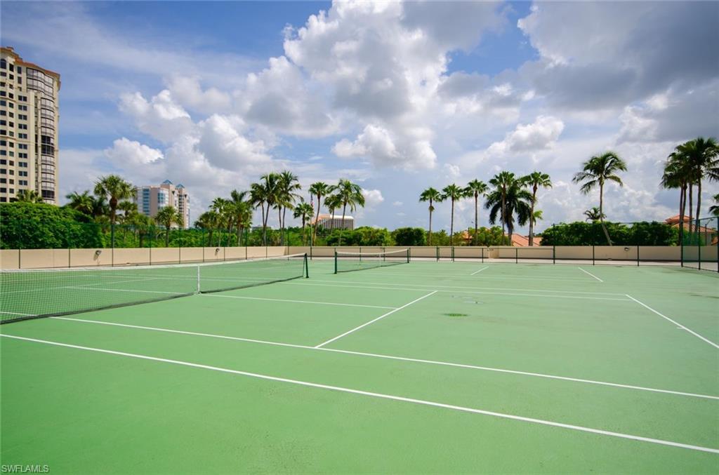 View of tennis court with community basketball court