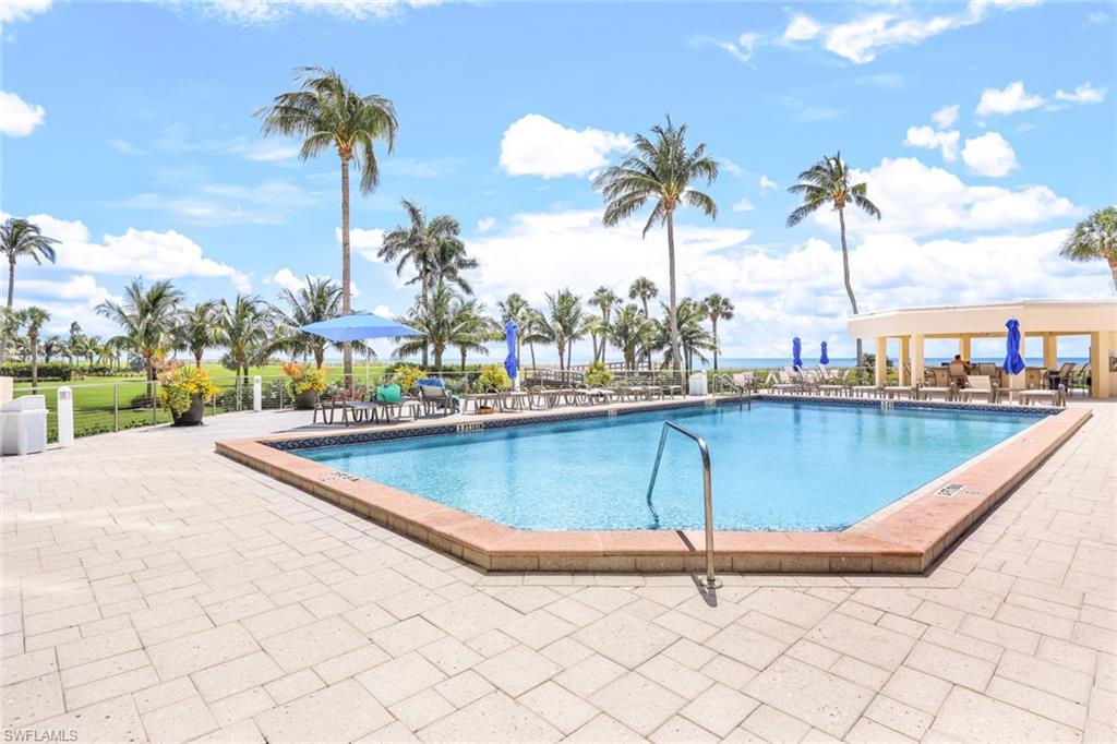 Community pool with a patio area
