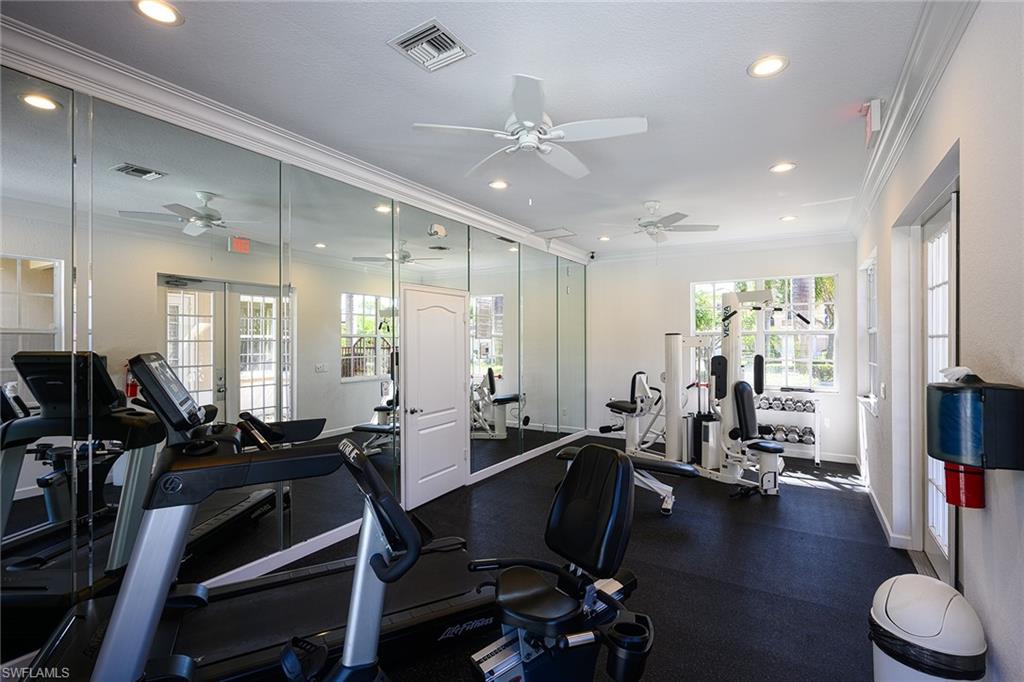 Gym featuring crown molding and ceiling fan