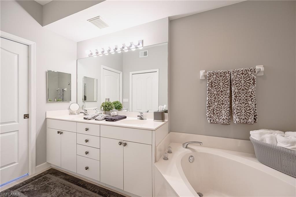 Bathroom with a bathtub and vanity