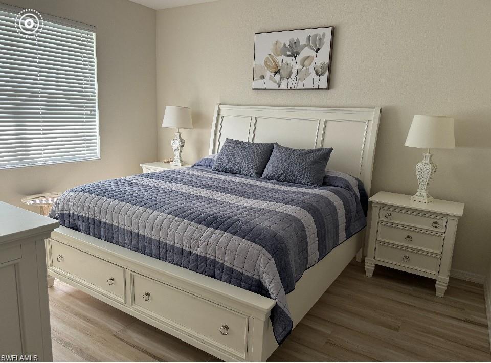 Bedroom with light wood-style floors