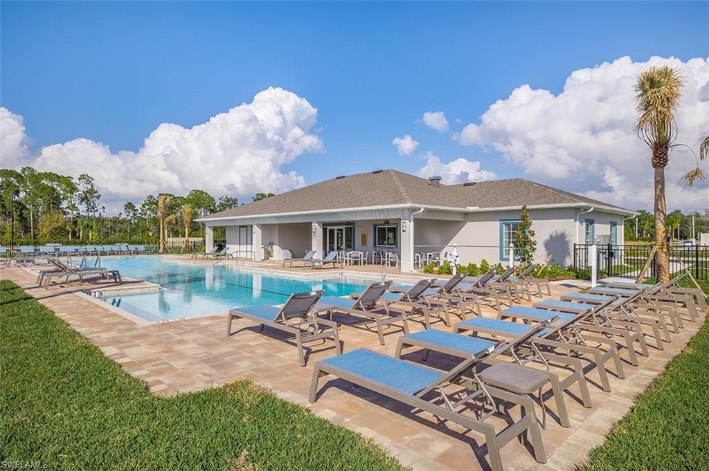 Community pool featuring a patio