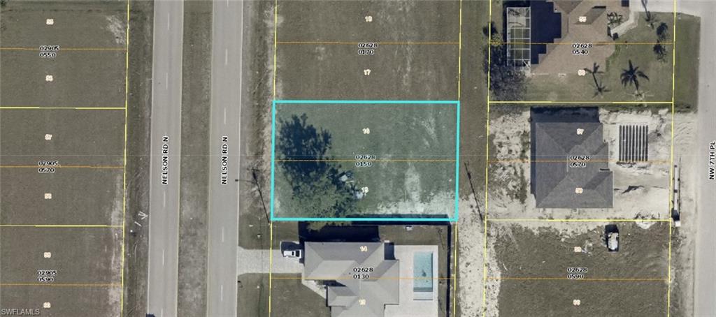 Aerial overview of property's location featuring property parcel outlined