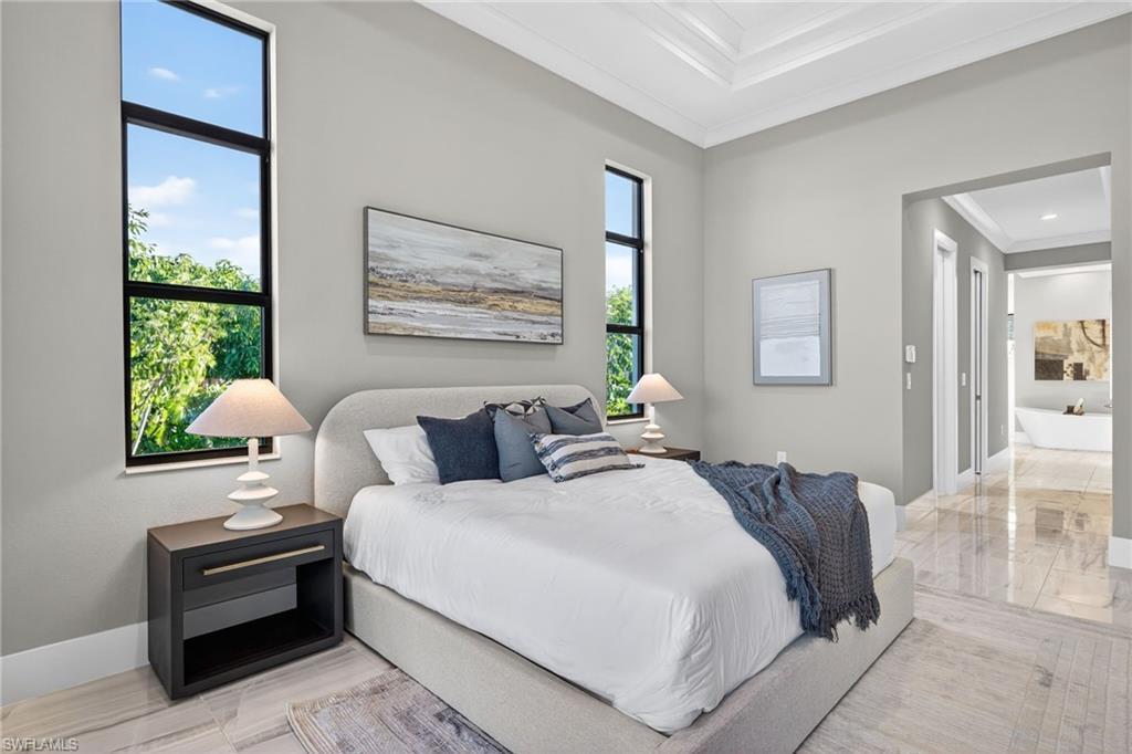 Bedroom featuring baseboards and ornamental molding