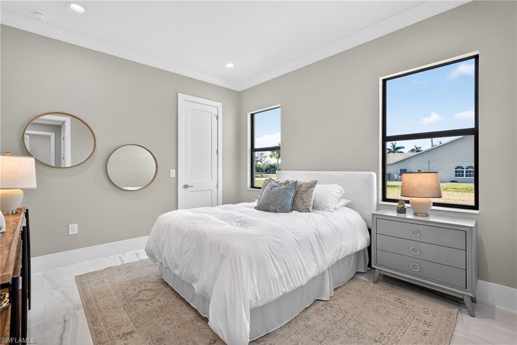 Bedroom featuring recessed lighting and crown molding
